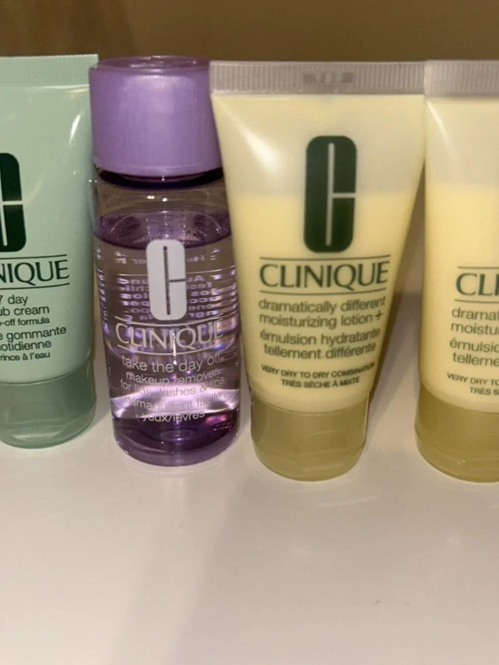 Clinique 4pc Skin Care Travel Set 7-Day Scrub Cream,Take The Day Off & 2 Lotions